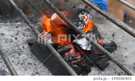 Hot Glowing Charcoal on a Simple Barbecue Grill Hot Glowing Charcoal on a Simple Barbecue Grill 140086903