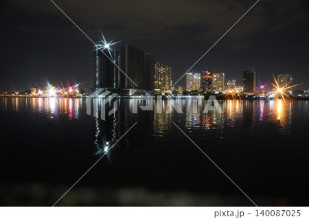 Cityscape at Night Reflected in Water Urban Night Scene Cityscape at Night Reflected in Water Urban Night Scene 140087025