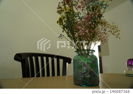 Colorful Gypsophila Flowers in Blue Glass Vase Colorful Gypsophila Flowers in Blue Glass Vase 140087168