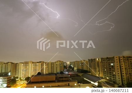 Lightning Storm Over City Buildings at Night Lightning Storm Over City Buildings at Night 140087211