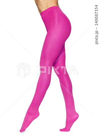 Woman wearing vibrant pink opaque hosiery tights 140087354