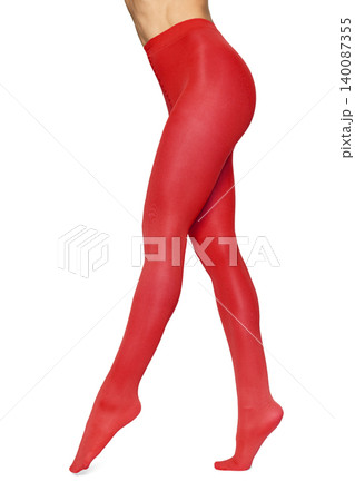 Woman wearing vibrant red pantyhose on white background Woman wearing vibrant red pantyhose on white background 140087355