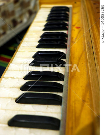 Close-Up View of Harmonium Keys and Wooden Body 140088269