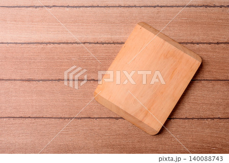 Empty wooden cutting board for preparing ingredients for home cooking. An empty cutting board Empty wooden cutting board for preparing ingredients for home cooking. An empty cutting board 140088743