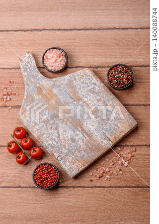 Empty wooden cutting board for preparing ingredients for home cooking. An empty cutting board 140088744