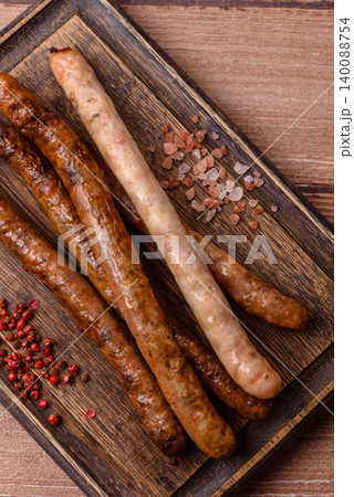 Thin chicken or pork sausages grilled or barbecued. Grilled sausages Thin chicken or pork sausages grilled or barbecued. Grilled sausages 140088754