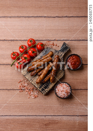 Thin chicken or pork sausages grilled or barbecued. Grilled sausages Thin chicken or pork sausages grilled or barbecued. Grilled sausages 140088755