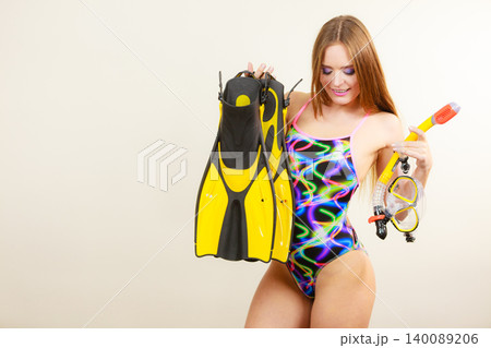 Woman with flippers and snorkeling mask having fun 140089206