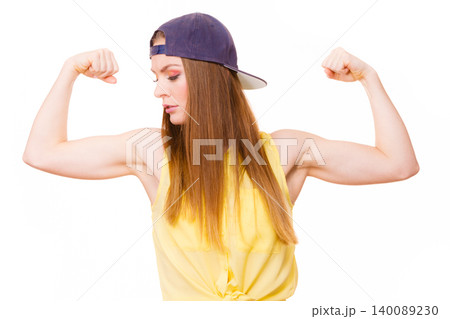 Woman casual style showing off muscles biceps Woman casual style showing off muscles biceps 140089230