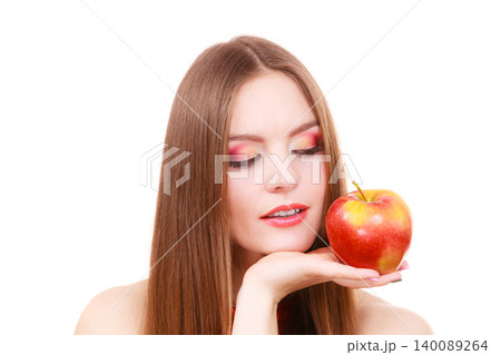 Woman charming girl colorful makeup holds apple fruit Woman charming girl colorful makeup holds apple fruit 140089264