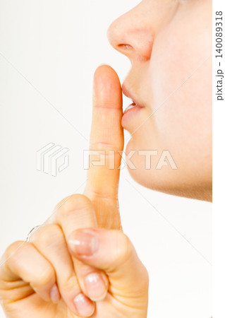 Woman showing silence gesture with finger 140089318