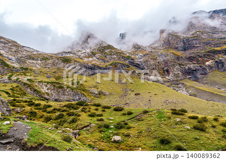 Hiking trail in Cirque de Troumouse at Heas in the Hautes-Pyrenees department in France, forming the border with Spain 140089362