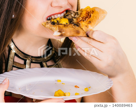 Woman eating hot pizza slice Woman eating hot pizza slice 140089463