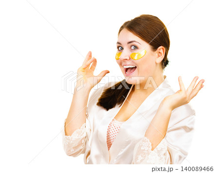 Woman with gold patches under eyes Woman with gold patches under eyes 140089466