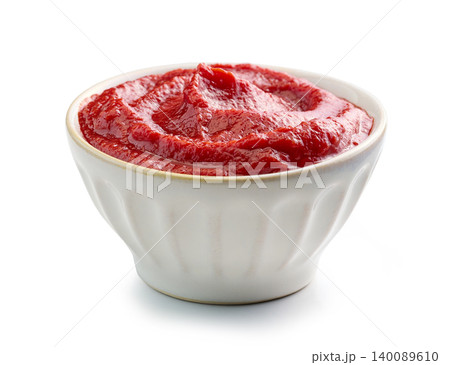Tomato Sauce or Ketchup in a Light Ceramic Bowl Isolated on White Background Tomato Sauce or Ketchup in a Light Ceramic Bowl Isolated on White Background 140089610