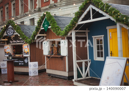 Charming wooden holiday kiosks with snow-dusted roofs Charming wooden holiday kiosks with snow-dusted roofs 140090007