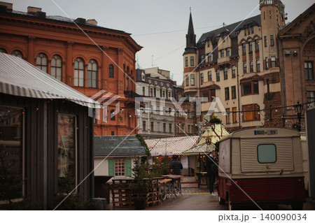 Panoramic view of a festive city square featuring historic eclectic architecture Panoramic view of a festive city square featuring historic eclectic architecture 140090034