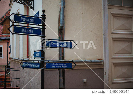 Blue Directional Street Signage in Historical Old Town District 140090144