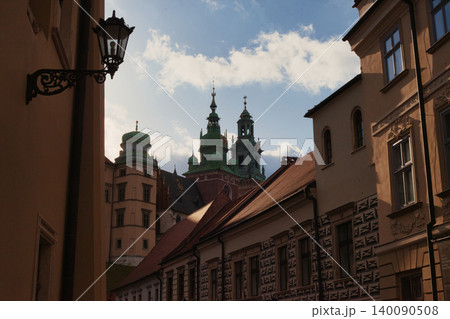 Historic city alley with scenic view of cathedral towers Historic city alley with scenic view of cathedral towers 140090508