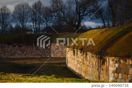Scenic View of Ancient Stone Fortress Walls and Grass  140090716