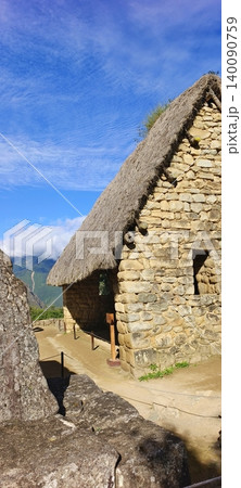 A traditional Inca stone house with a thatched roof in Machu Picchu A traditional Inca stone house with a thatched roof in Machu Picchu 140090759