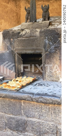 A traditional Inca clay oven with tray baking in Peru 140090762