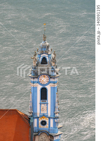 Parish and Collegiate Church of the Assumption of Mary in Durnstein by the Danube river showing historic architecture. Parish and Collegiate Church of the Assumption of Mary in Durnstein by the Danube river showing historic architecture. 140091195