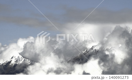 A snow capped mountain peak emerges from the clouds in the Austrian Alps, creating a spectacular picture of fog and light. A snow capped mountain peak emerges from the clouds in the Austrian Alps, creating a spectacular picture of fog and light. 140091273