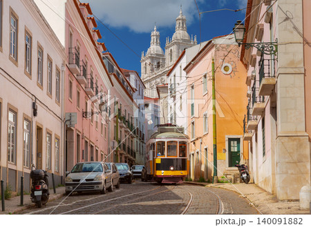 Historic Yellow Tram on Street with National Pantheon in Lisbon Portugal 140091882