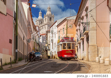 Historic Red Tram on Street with National Pantheon in Lisbon Portugal Historic Red Tram on Street with National Pantheon in Lisbon Portugal 140091883