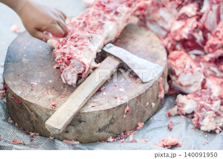 the cook prepares meat for the meat the cook prepares meat for the meat 140091950
