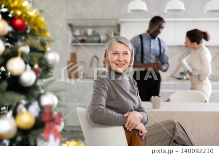 Elderly woman rejoices over married couple quarrel during New Year holiday 140092210