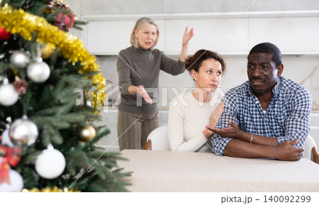 Elderly woman scolds married couple while celebrating Christmas 140092299