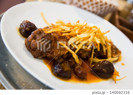 Catalan stew with raisins and plums Catalan stew with raisins and plums 140092338