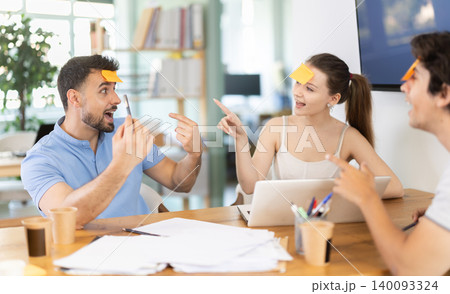 Office employees playing a guessing game 140093324