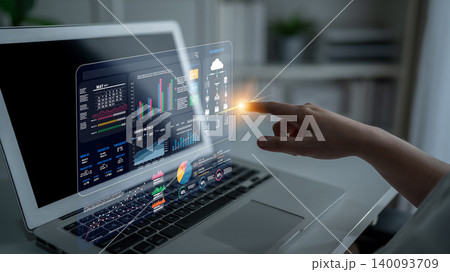 Touchscreen Interaction with Data Visualization on Laptop Display in Modern Workspace Setting with Infographics and Graphs Fluxor 140093709
