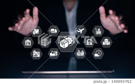Businessman Interacting with Digital Icons Representing Logistics and Delivery Management on a Futuristic Tablet Interface in a Dark Setting Ledger Businessman Interacting with Digital Icons Representing Logistics and Delivery Management on a Futuristic Tablet Interface in a Dark Setting Ledger 140093762