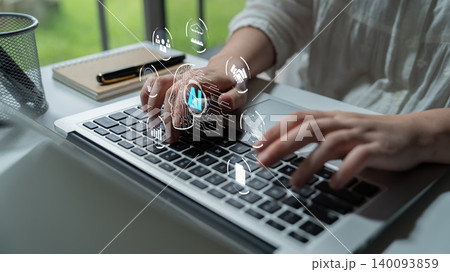 Hands Typing on Laptop with Futuristic Digital Interface and Data Icons Displayed, Representing Technology and Innovation in Work Environment Quark 140093859