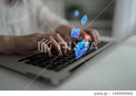 Close-up of Hands Typing on Laptop Keyboard with Email Notifications and Incoming Messages Concept Represented by Colorful Icons Gantry Close-up of Hands Typing on Laptop Keyboard with Email Notifications and Incoming Messages Concept Represented by Colorful Icons Gantry 140094068