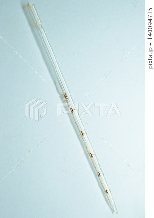Glass volumetric pipette displaying precise markings for accurate liquid measurement, essential for scientific experiments, chemical analysis, and laboratory work Glass volumetric pipette displaying precise markings for accurate liquid measurement, essential for scientific experiments, chemical analysis, and laboratory work 140094715
