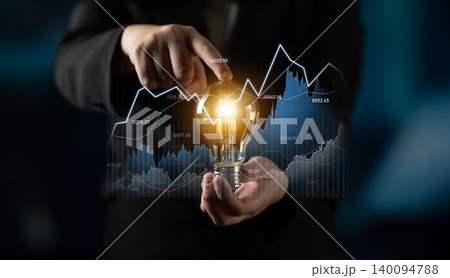 Businessman Holding Light Bulb with Financial Chart Background Illustrating Innovative Ideas for Investment and Growth in Modern Economy Scalp 140094788