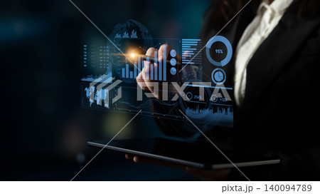 Business professional using digital tablet to analyze financial data with futuristic interface and graphs in a modern office environment Scalp Business professional using digital tablet to analyze financial data with futuristic interface and graphs in a modern office environment Scalp 140094789