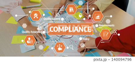 Team Collaboration on Compliance Strategy with Colorful Sticky Notes and Hands Over Table in an Engaging Workshop Environment. Amity 140094796