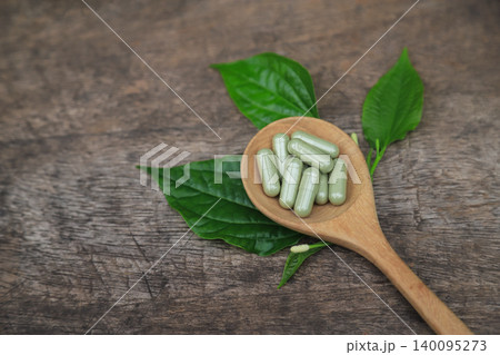 Herbal supplement capsules from Wildbetal Leafbush for use as a medicine in eating Herbal supplement capsules from Wildbetal Leafbush for use as a medicine in eating 140095273