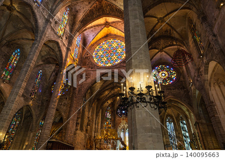 Cathedral interior in Palma, Mallorca, Spain featuring stained glass and stone architecture 140095663