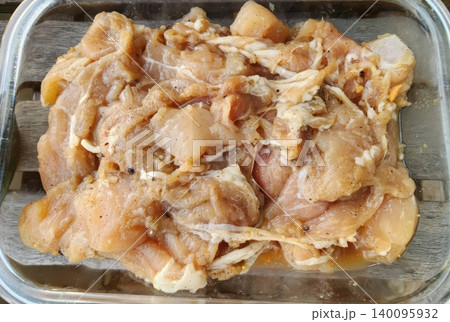 Fresh Raw Marinated Chicken Pieces in Glass Bowl for Meal Prep Fresh Raw Marinated Chicken Pieces in Glass Bowl for Meal Prep 140095932