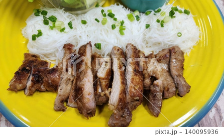 Grilled Marinated Pork Slices Served with Rice Vermicelli and Spring Onions Grilled Marinated Pork Slices Served with Rice Vermicelli and Spring Onions 140095936