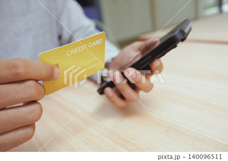 Credit card used for secure online shopping payment and mobile checkout. Credit card used for secure online shopping payment and mobile checkout. 140096511