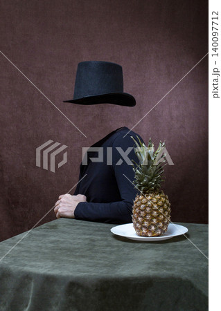 The Invisible Man at the table with a pineapple 140097712