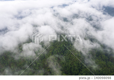 Landscape of Morning Mist with Mountain Layer. mountain ridge and clouds in rural jungle bush forest Landscape of Morning Mist with Mountain Layer. mountain ridge and clouds in rural jungle bush forest 140098098